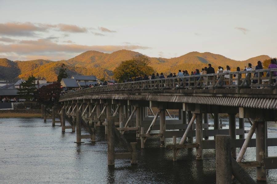 Togetsukyō Bridge, or "Moon Crossing Bridge," is a scenic landmark in Arashiyama, Kyoto. It spans the Katsura River and offers stunning views, especially during spring cherry blossoms and autumn foliage.