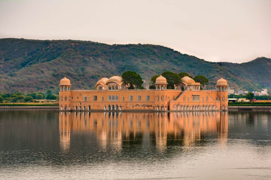 Jal Mahal palace standing in the middle of Man Sagar Lake with hills in the background, Jaipur, Rajasthan