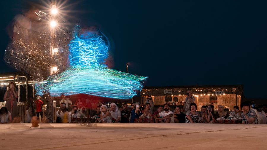 After an incredible Desert Safari in the Arabian Desert near Dubai, visitors were treated to a traditional Tanoura dance performance. The dancer spun continuously with cultural artefacts and LED-lit costumes, and the image captures the motion in a single long-exposure shot with the LEDs glowing.