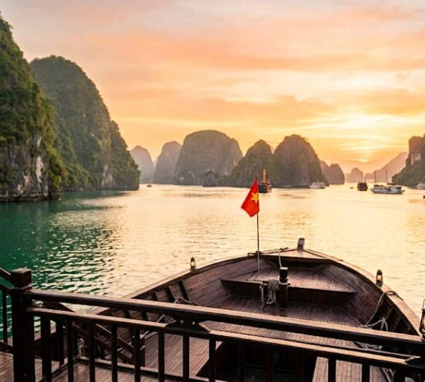 Vietnam budget honeymoon package from India featuring a romantic couple and scenic Ha Long Bay, Vietnam.